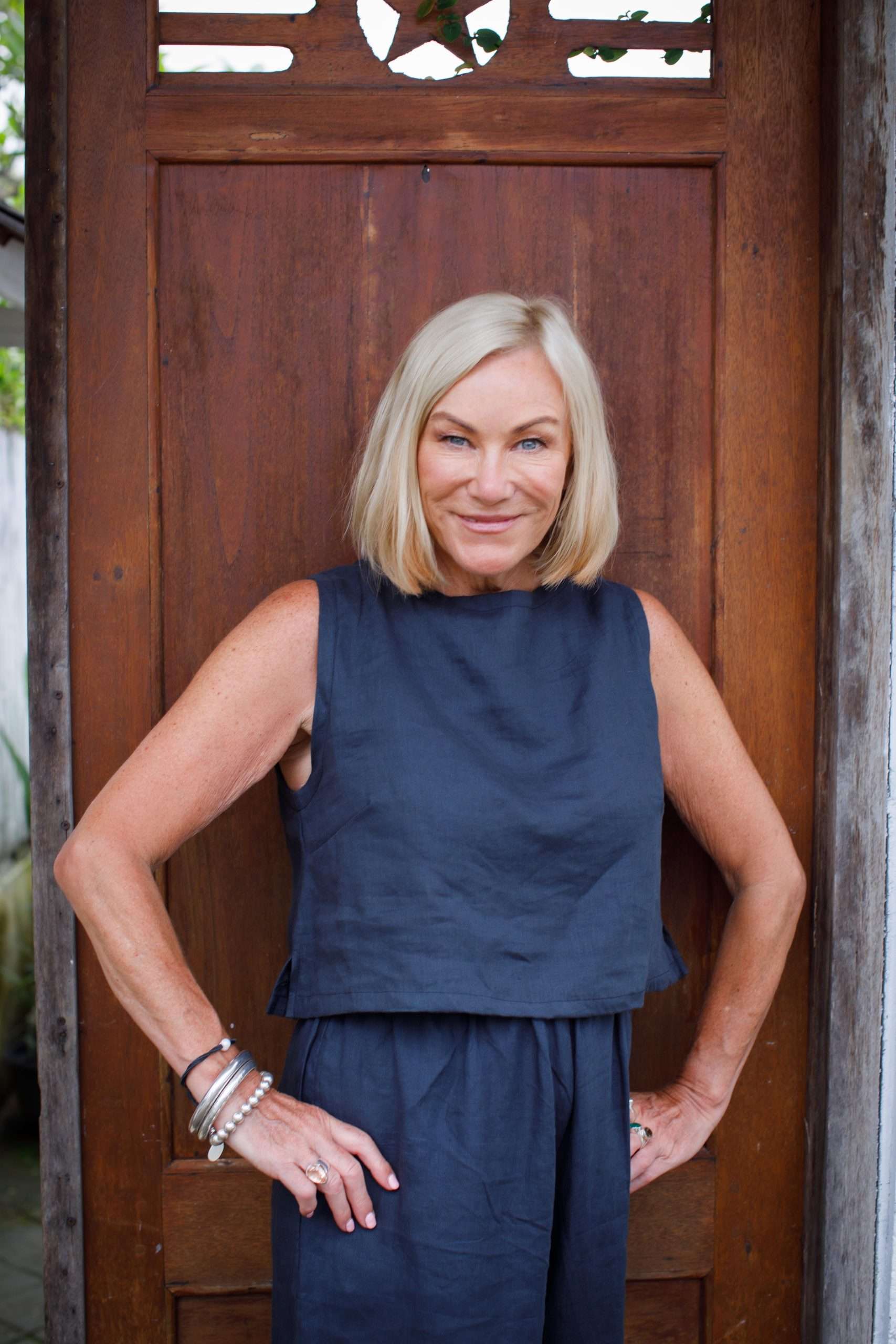 indigo linen top middle-aged woman showing front of sleeveless top